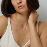 Matching set of gold pearl necklace and bracelet