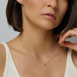 A sparkling gold diamond necklace with matching earrings