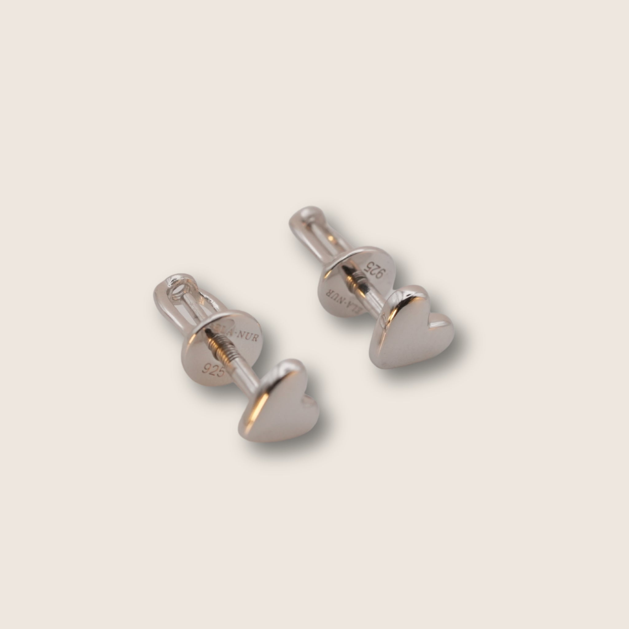 Silver heart studs